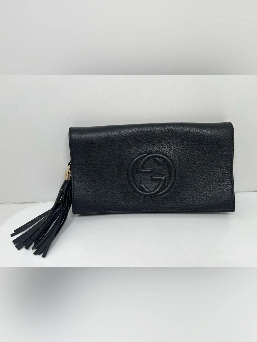 Gucci Black Pebbled Clutch Tassel Logo Gold Hardware